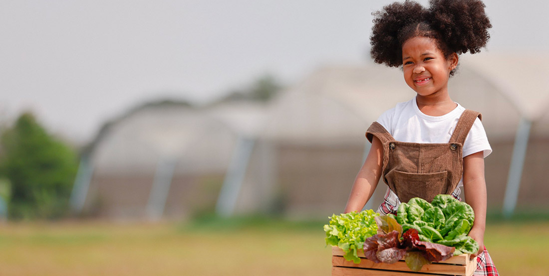 little-african-american-curly-hair-girl-farmer-holding-basket-of-fresh-salad-vegetable-at-farm_t20_lLdmg2